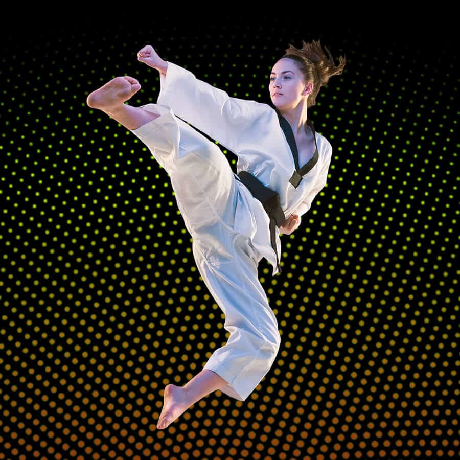 Martial Arts Lessons for Adults in Chesapeake VA - Girl Black Belt Jumping High Kick