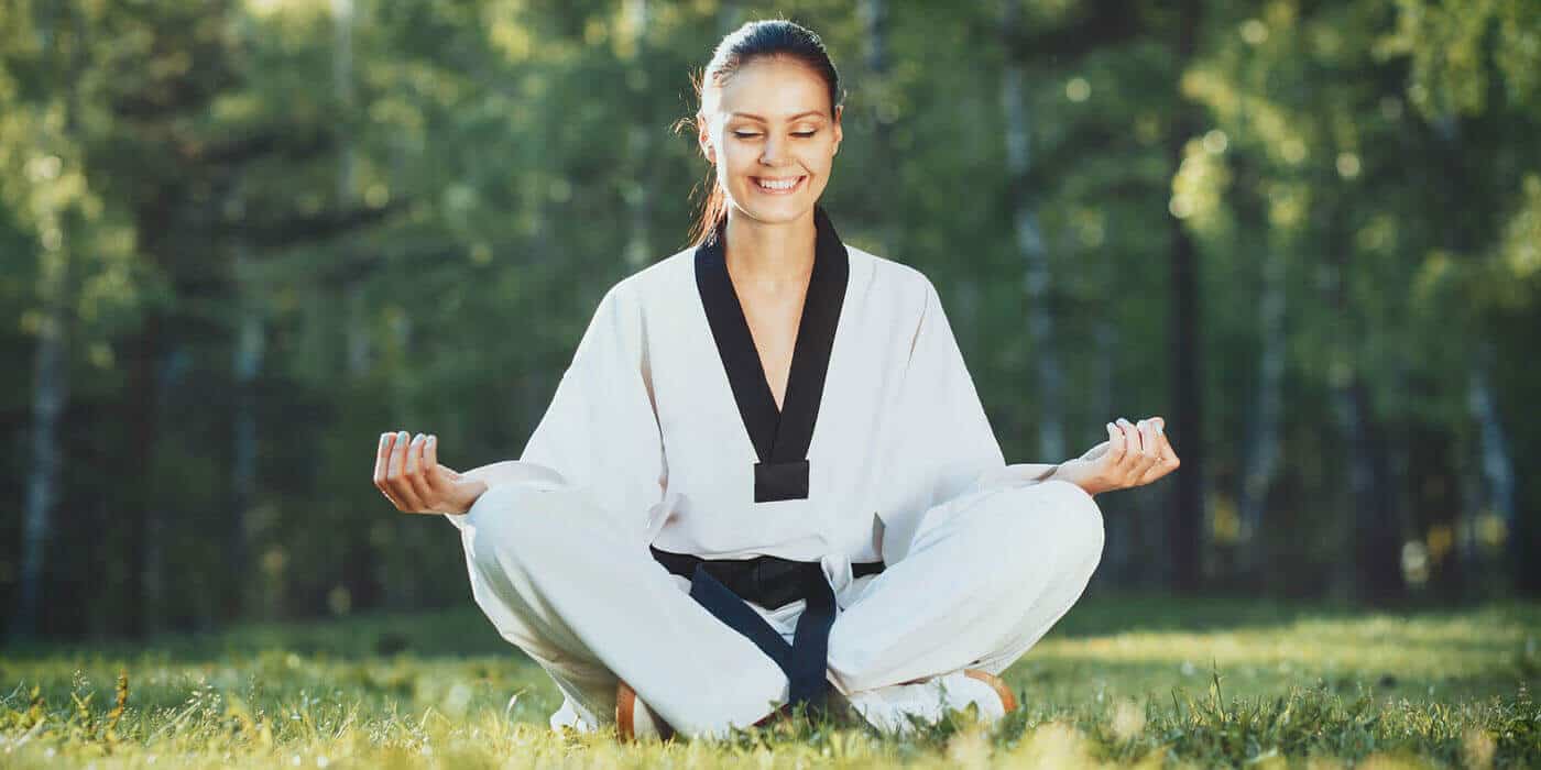 Martial Arts Lessons for Adults in Chesapeake VA - Happy Woman Meditated Sitting Background